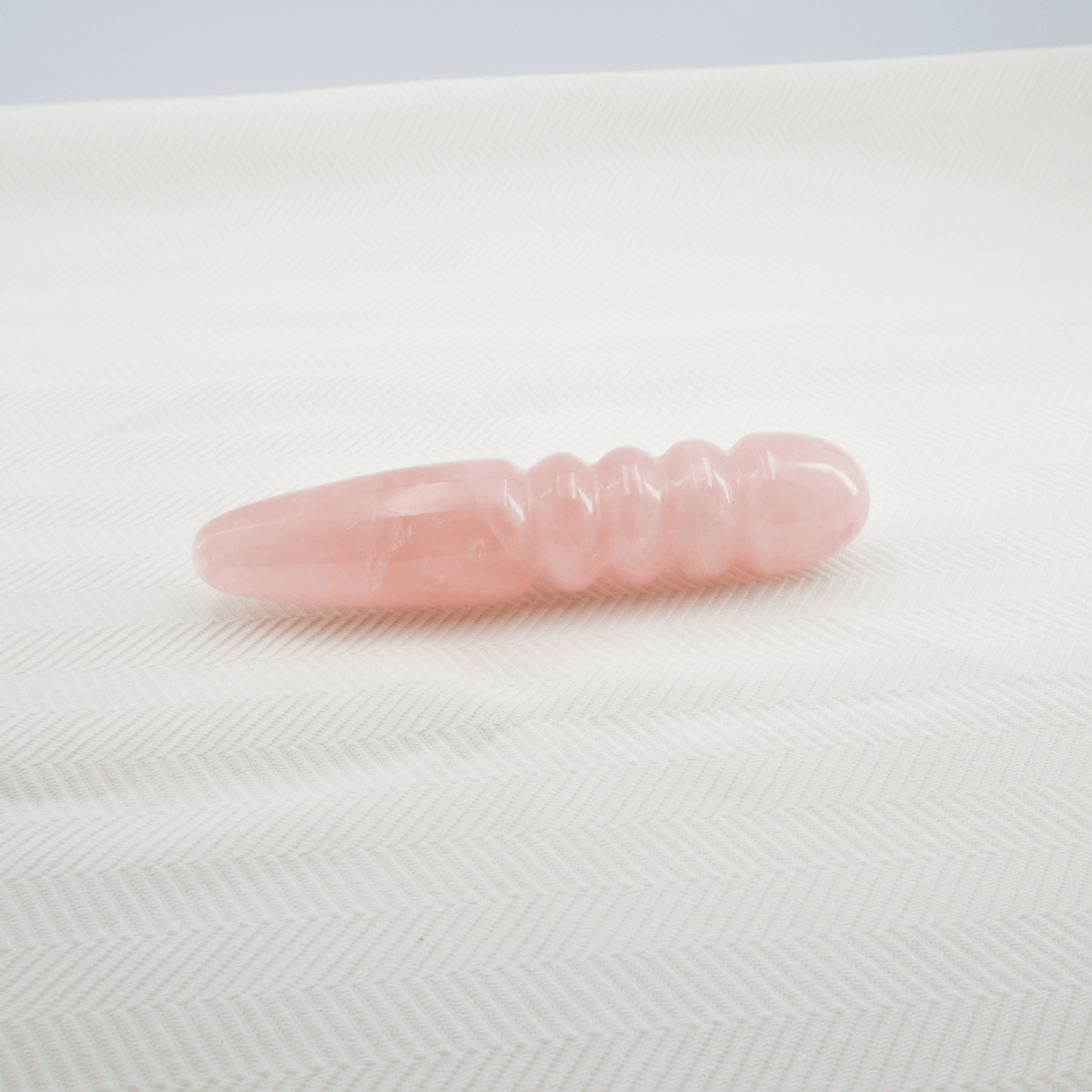 Unduluna: Elegant Rose Quartz Crystal Wand for Healing