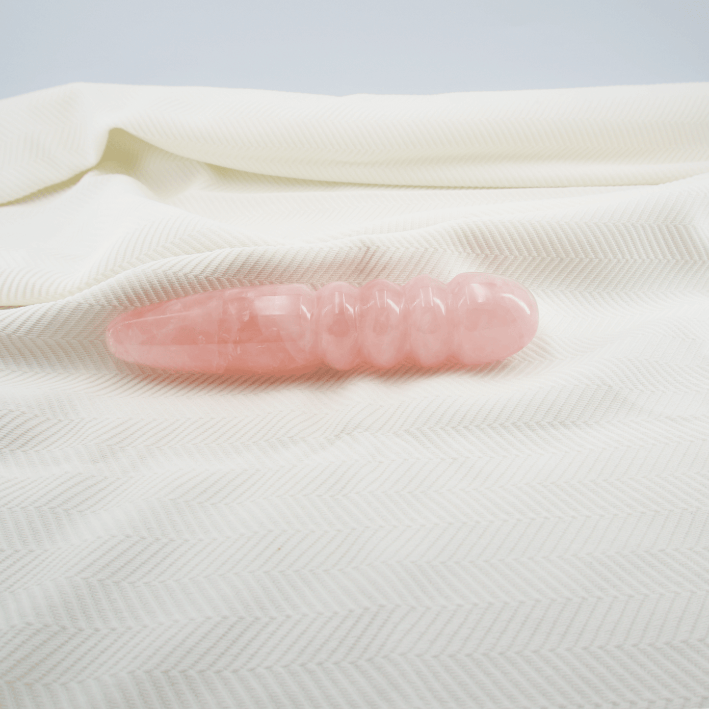 Unduluna: Elegant Rose Quartz Crystal Wand for Healing